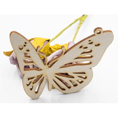Wooden butterfly ornament on a white background