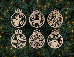 Set of six decorative Christmas ornaments on a green pine branch background with lights.