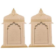 Two beige decorative wall pieces with intricate designs on a white background