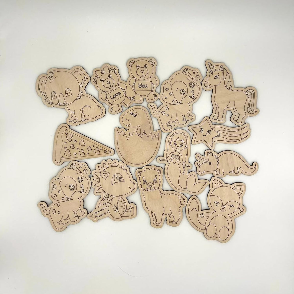 Set of wooden animal-shaped toys on a white background