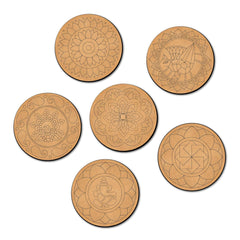 Set of six circular wooden coasters with intricate carvings on a white background