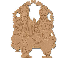 Wooden cutout of two seated figures with decorative elements on a white background