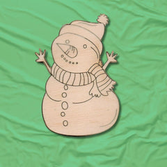 Wooden snowman decoration on a green fabric background