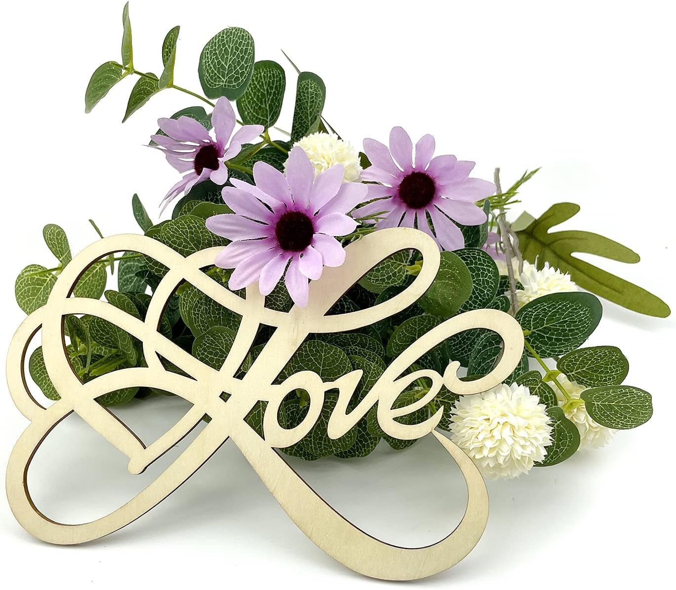 Decorative sign with 'love' and infinity symbol surrounded by flowers and greenery on a white background