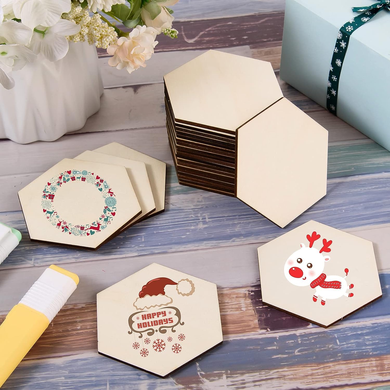 Hexagonal wooden coasters with Christmas designs on a wooden surface.