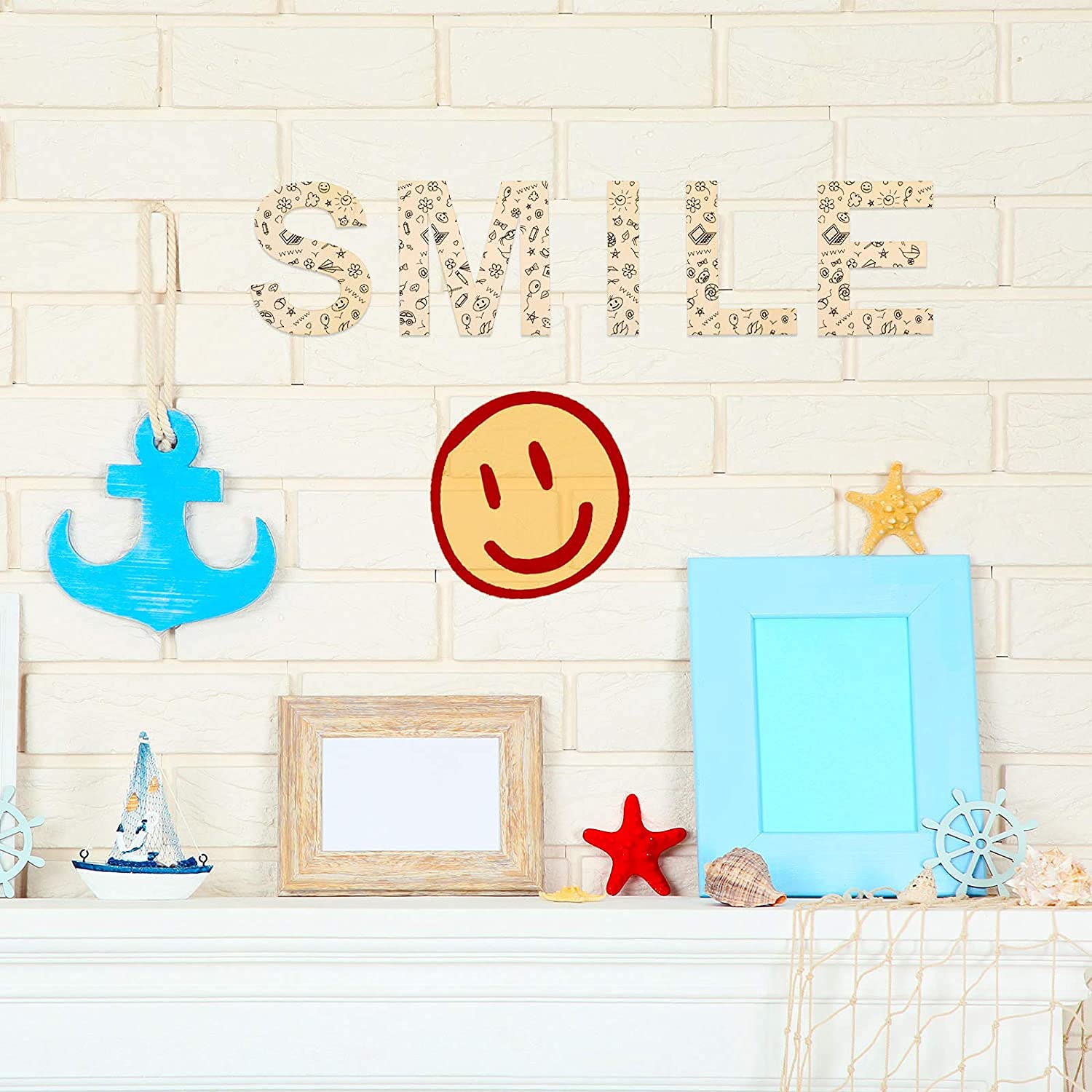 Decorative wall with 'SMILE' letters, colorful frames, and sea-themed items on a light background