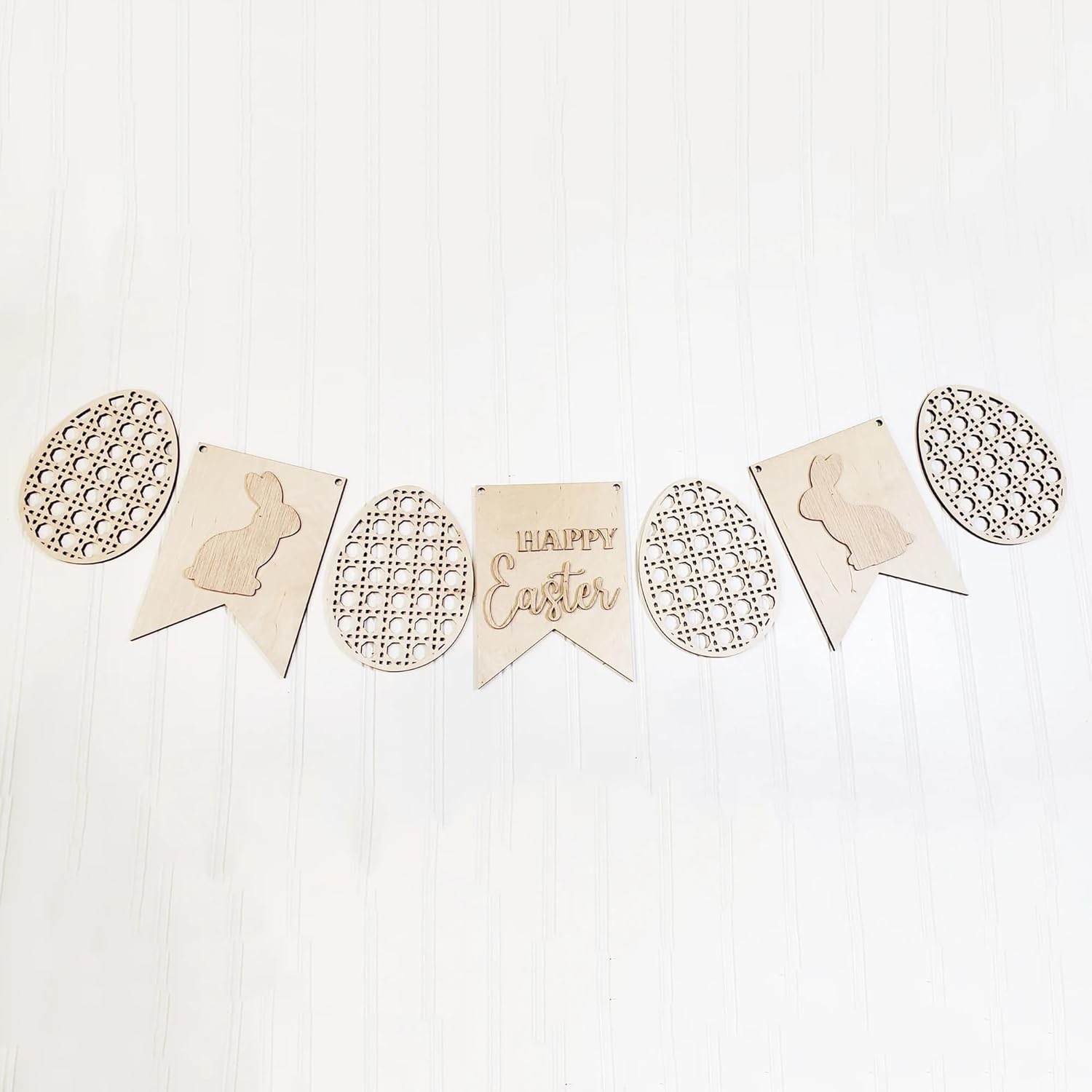 Wooden Easter banner with decorative elements on a white background