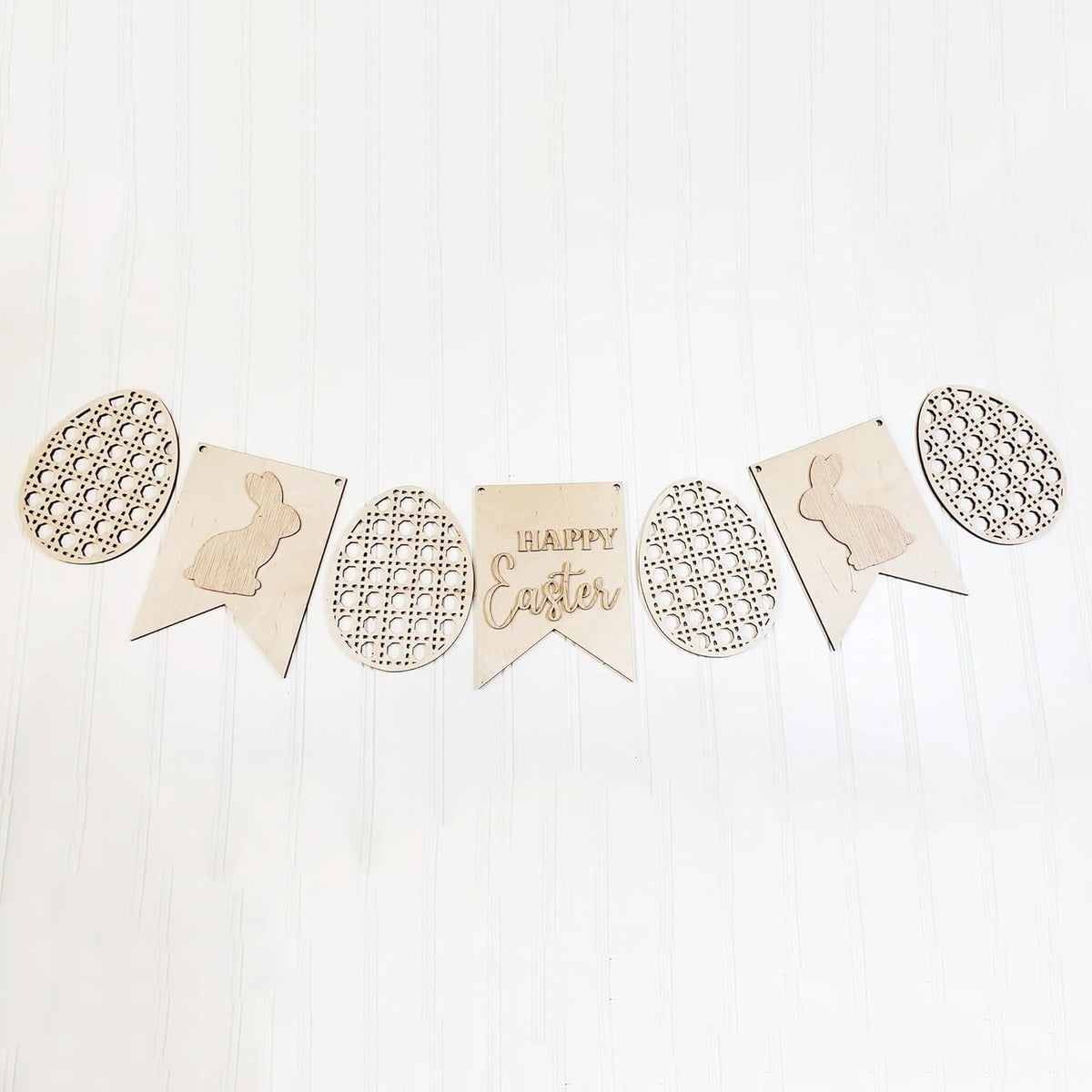 Wooden Easter banner with decorative elements on a white background