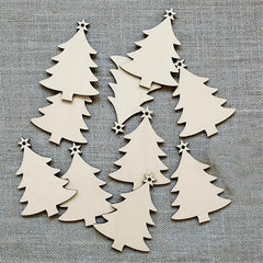 White Christmas tree-shaped cutouts with star decorations on a gray textured background