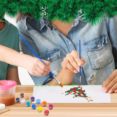 Two people painting a Christmas tree on paper with colorful paint and brushes.