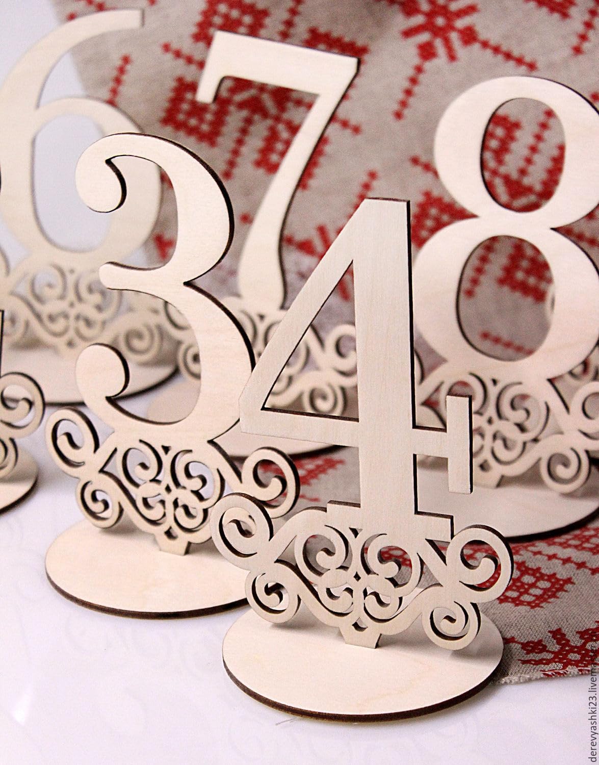 Wooden table numbers on a decorative background