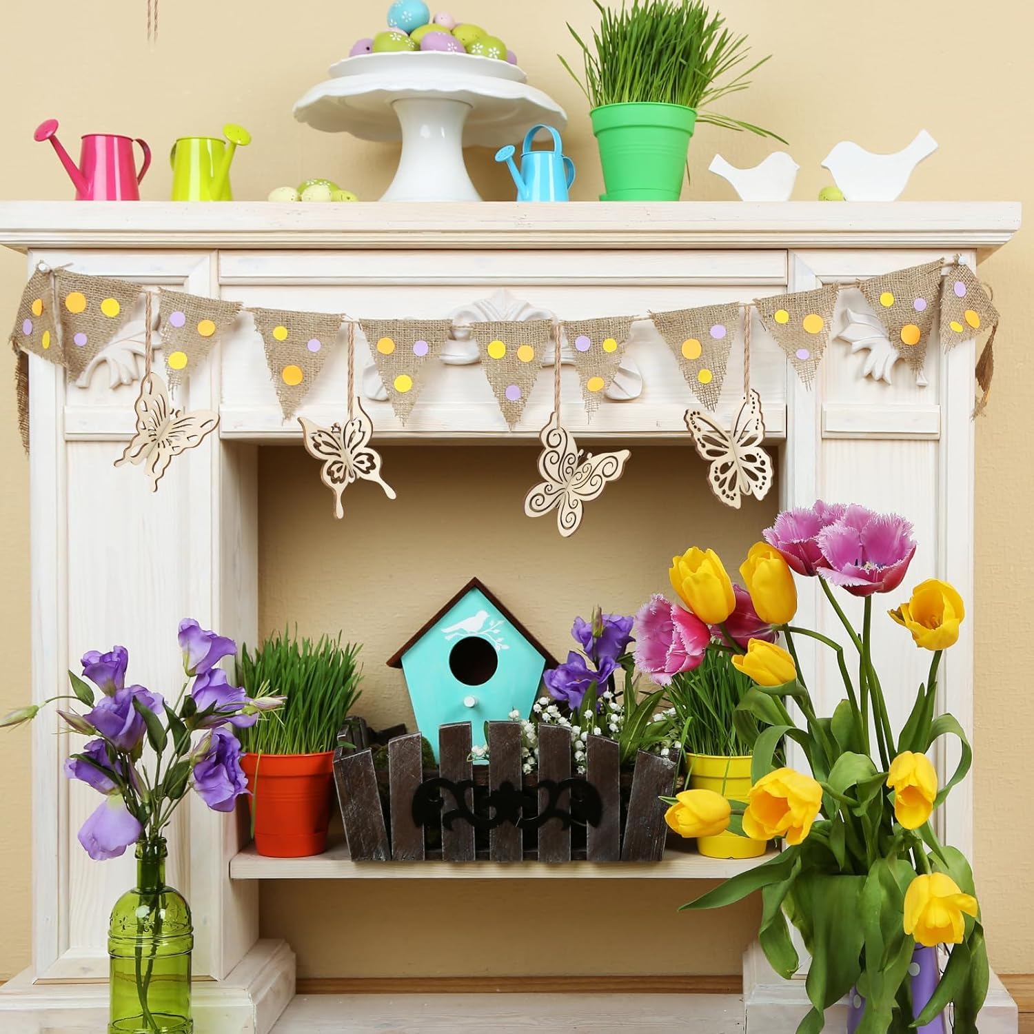 Decorative shelf with flowers, a birdhouse, and a banner on a beige wall.