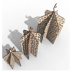 Decorative leaf-shaped objects with intricate patterns on a white background
