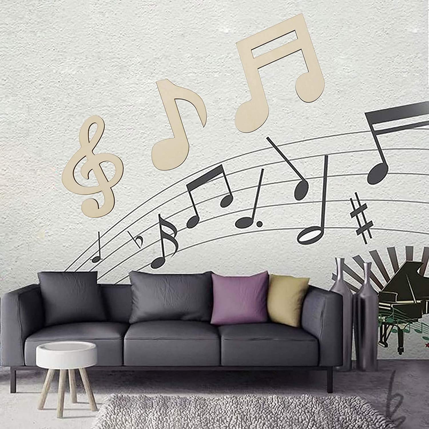 Living room with a gray sofa against a wall featuring musical notes and symbols.