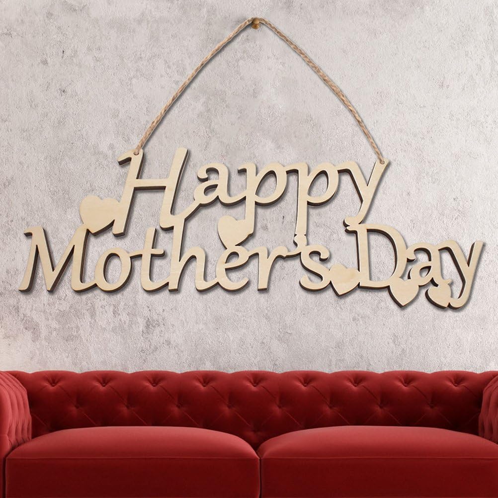 Wooden 'Happy Mother's Day' sign hanging on a textured wall with a red sofa below.
