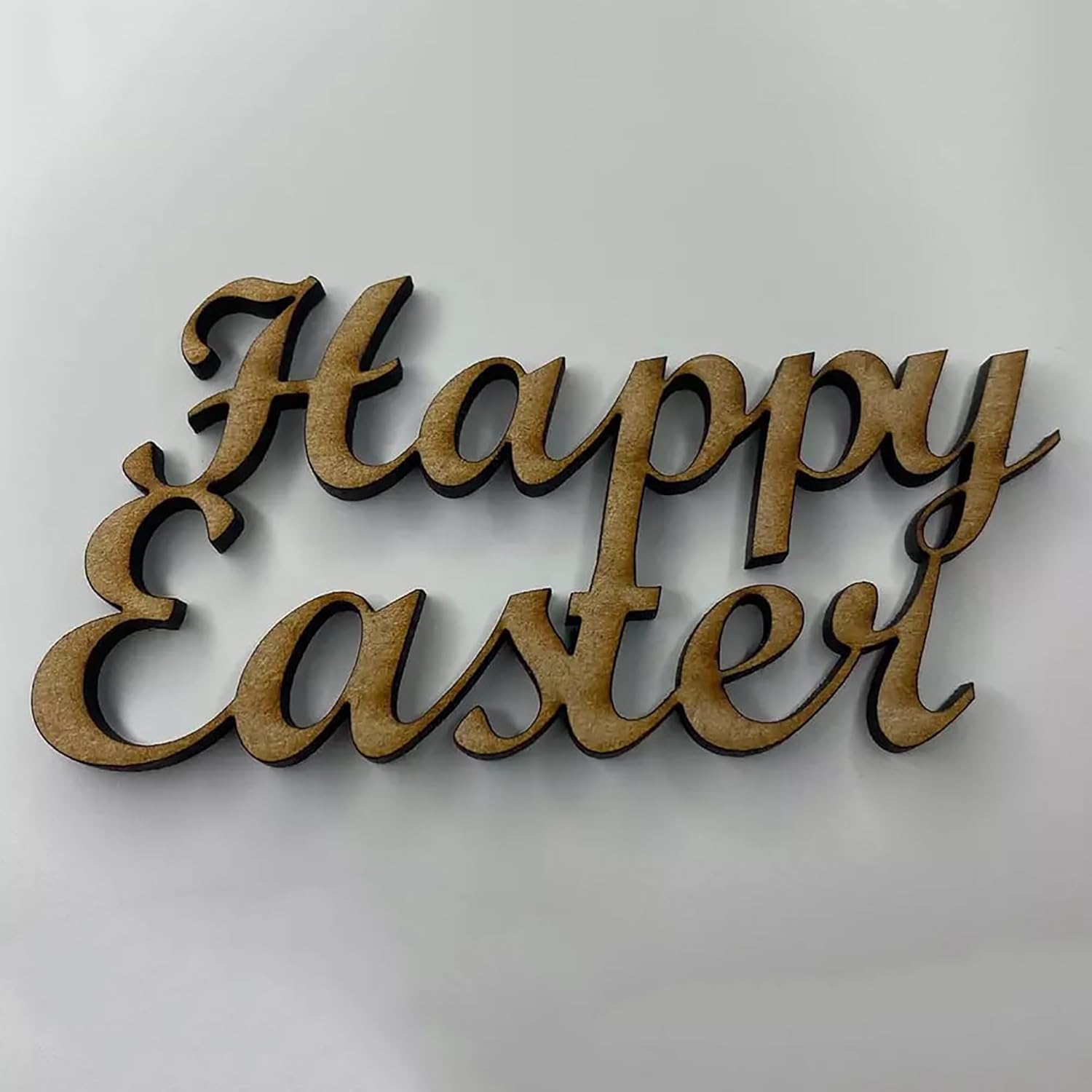 Wooden 'Happy Easter' decoration on a light gray background