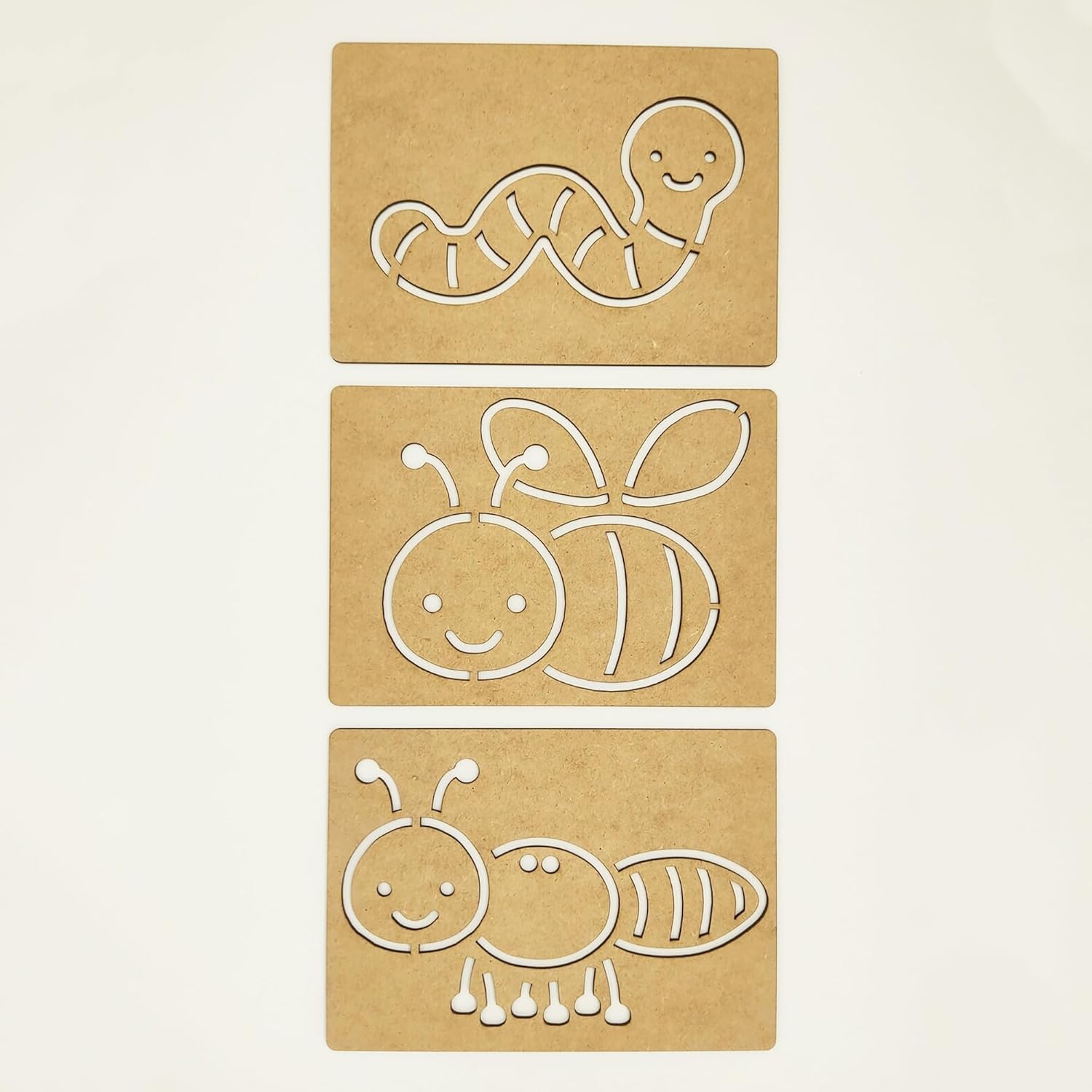Three cardboard cutouts of animals on a beige background