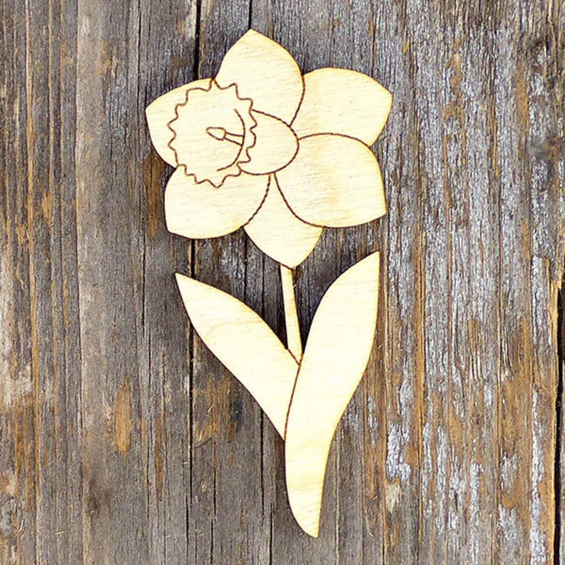 Wooden flower decoration on a wooden background
