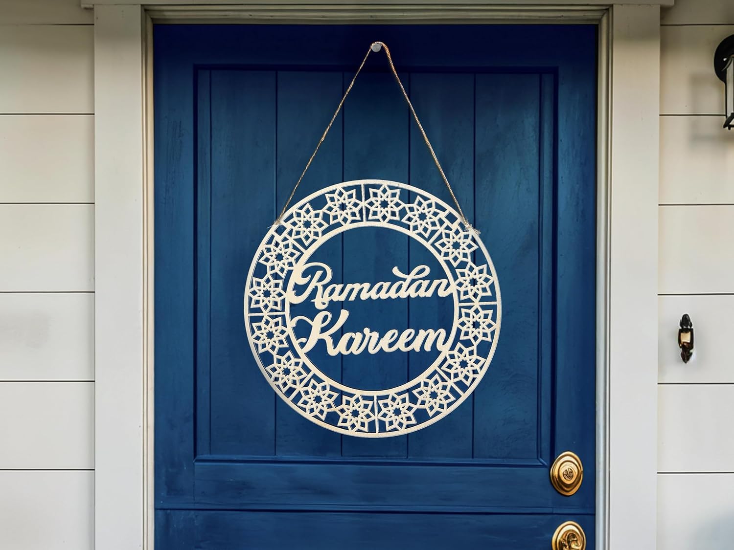 Decorative sign with 'Ramadan Kareem' on a blue door