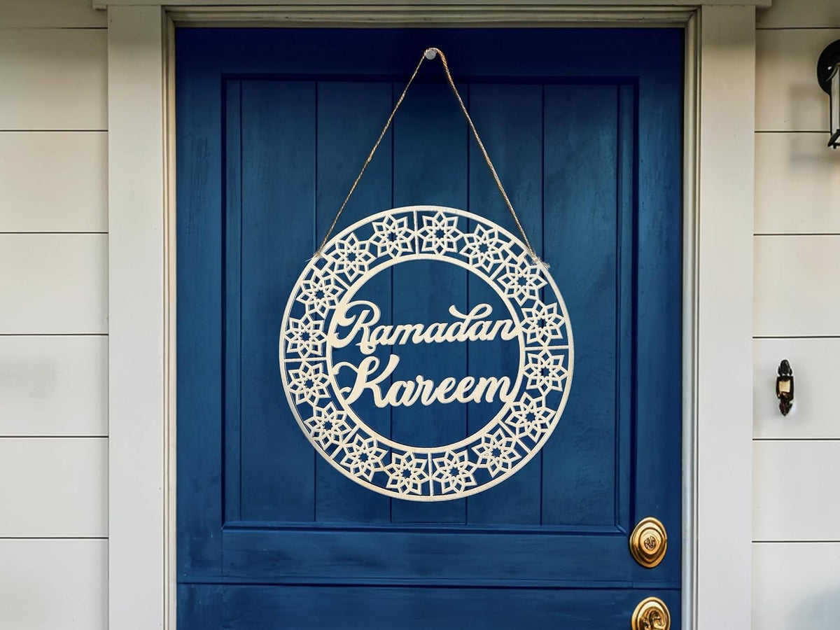 Decorative sign with 'Ramadan Kareem' on a blue door