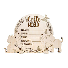 Wooden baby announcement plaque with elephants and decorative elements on a white background