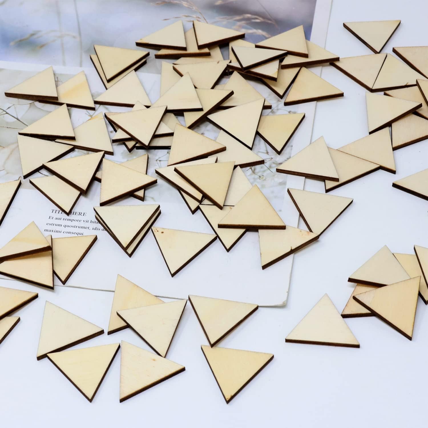 Collection of wooden triangles on a white surface