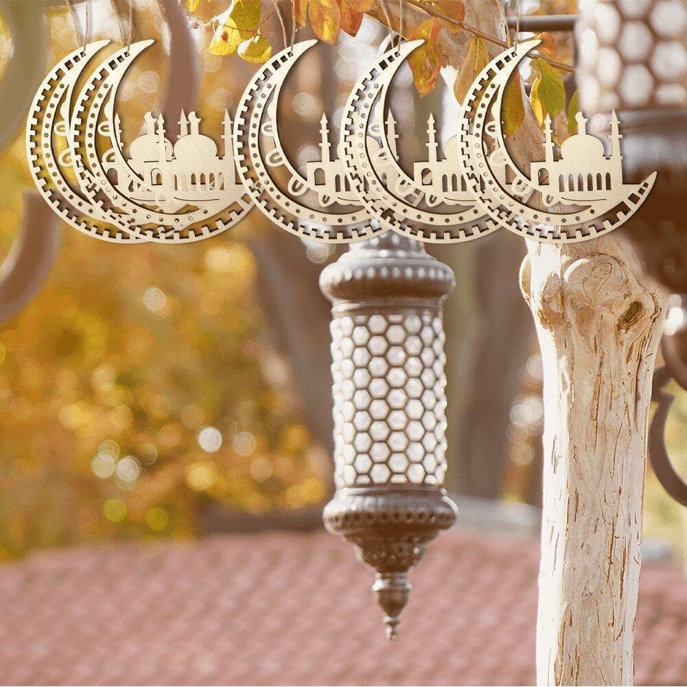 Decorative crescent moon and mosque design hanging from a tree with a blurred background