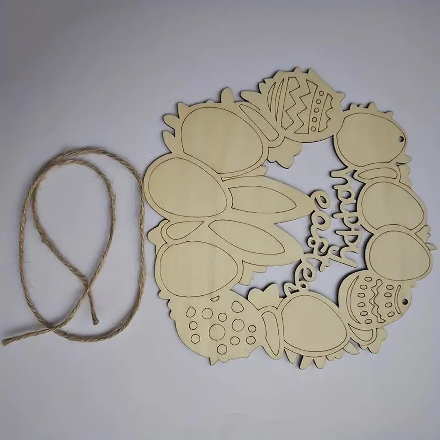 Decorative wreath cutout with string on a white background