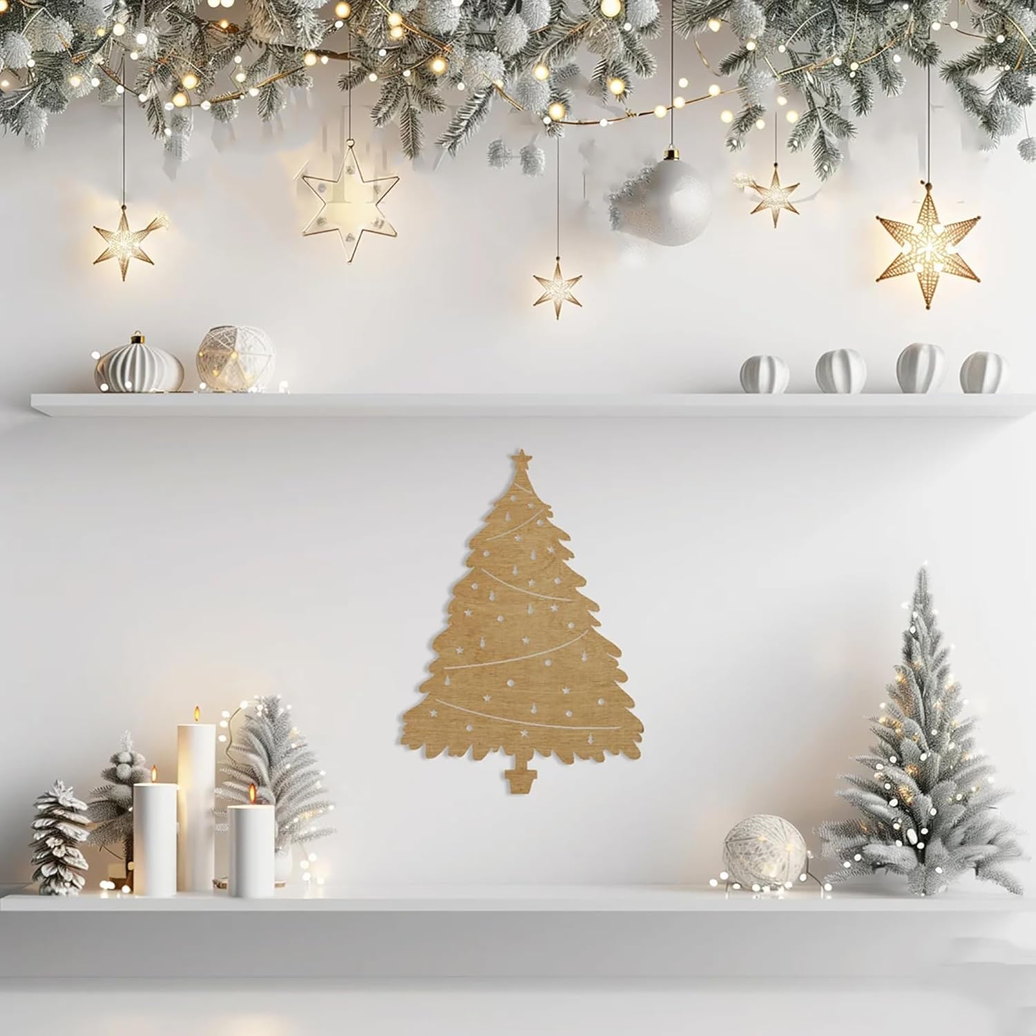 Decorative Christmas shelf with gold tree, lights, and ornaments on a white wall.
