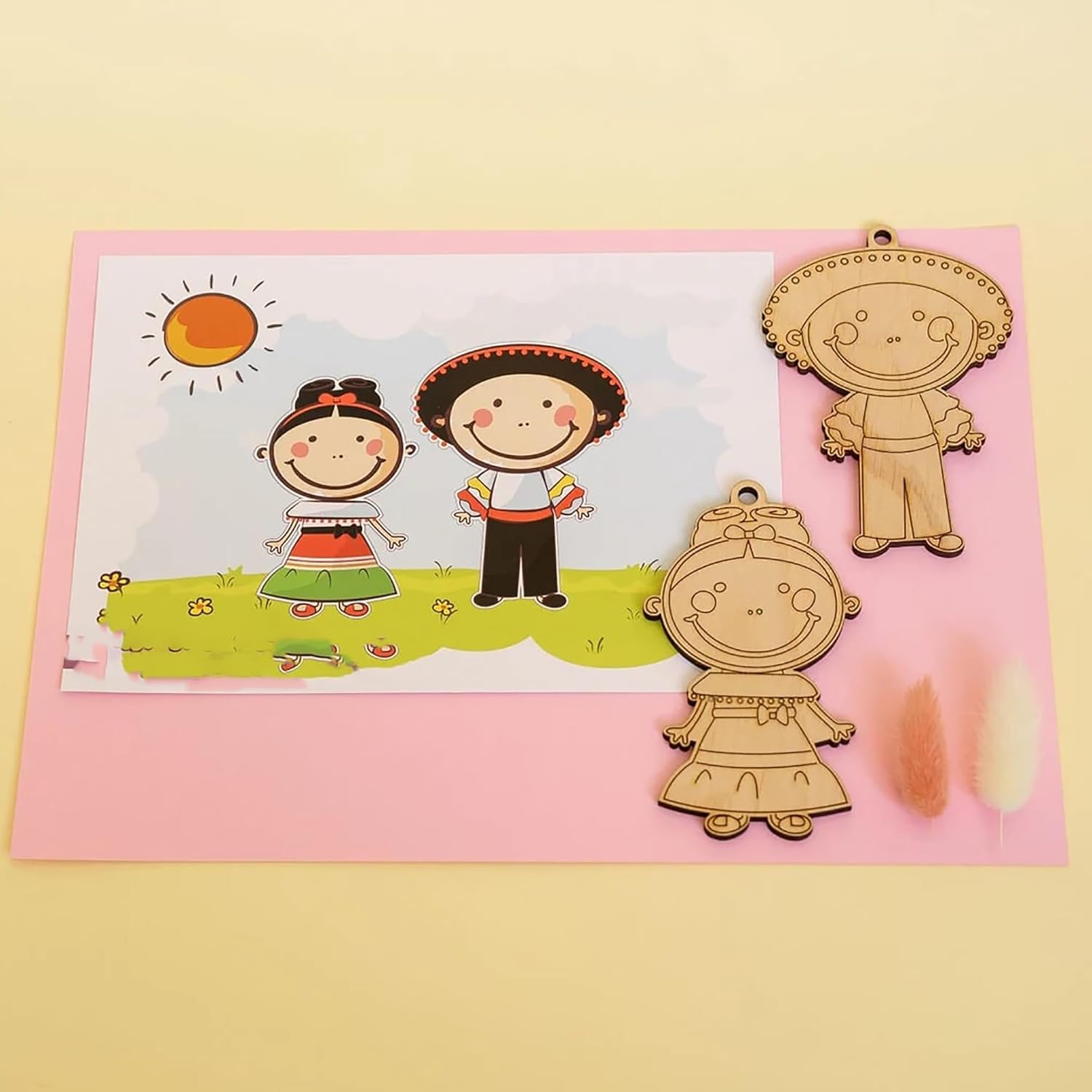 Wooden cutouts of cartoon characters on a pink card with a yellow background