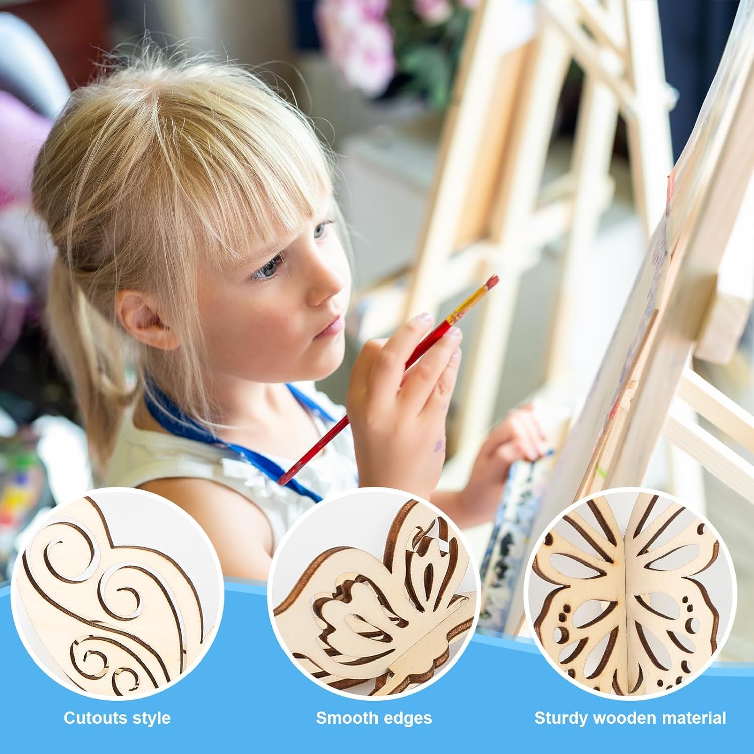 Young girl painting with a wooden art set on an easel, surrounded by cutout designs.