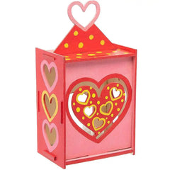 Decorative lantern with heart designs on a white background