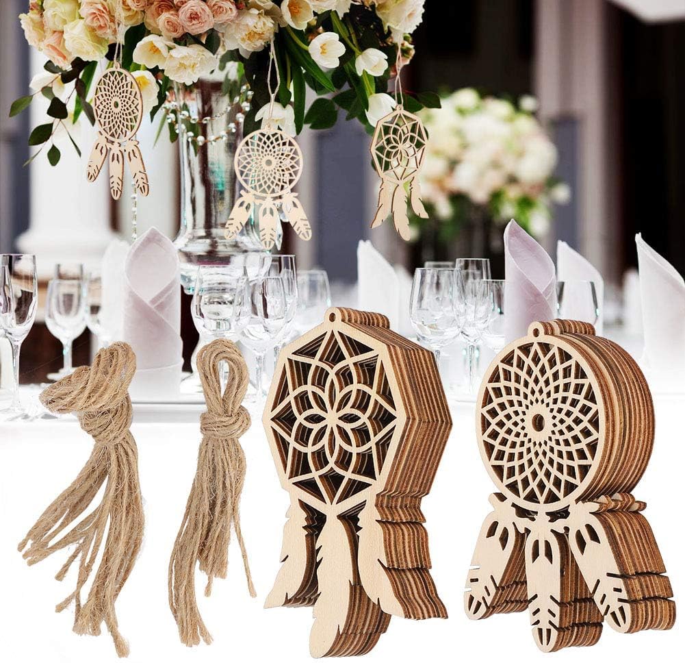 Wooden dreamcatcher decorations on a table with floral centerpieces.