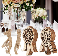 Wooden dreamcatcher decorations on a table with floral centerpieces.
