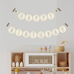 Happy Birthday banner on a wall above a shelf with decorative items.