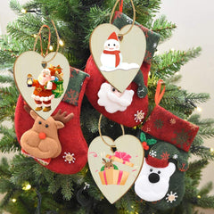 Decorative Christmas ornaments on a tree with Santa, reindeer, snowman, and bear designs.