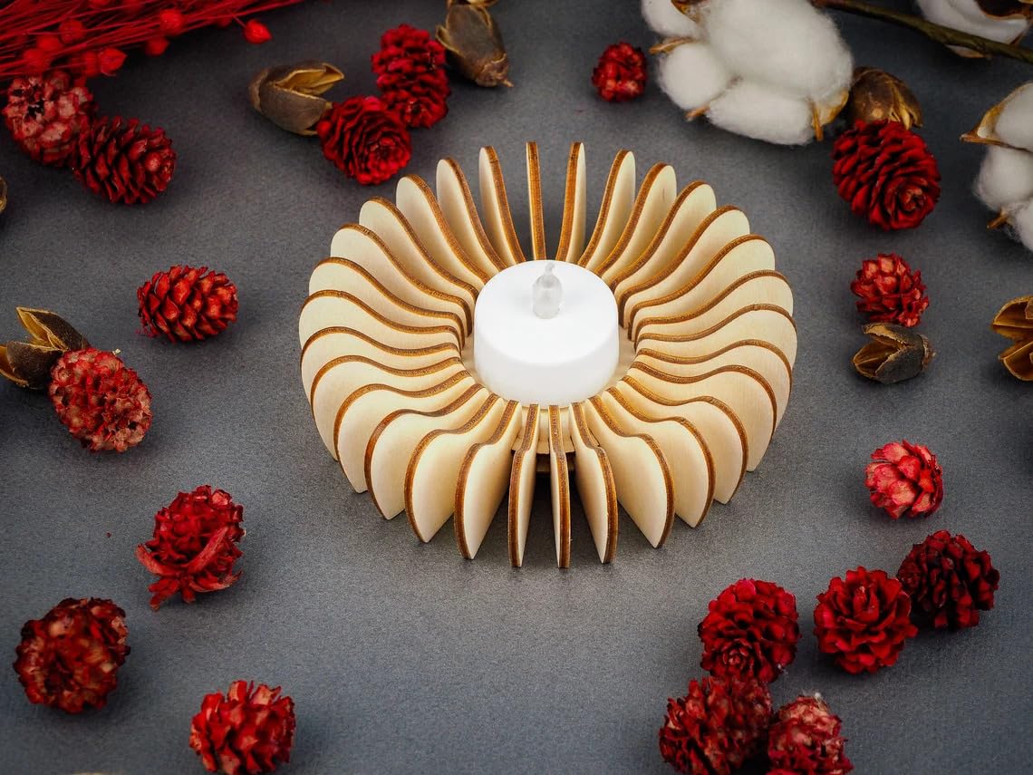 Decorative wooden candle holder with red pinecones and cotton on a dark surface