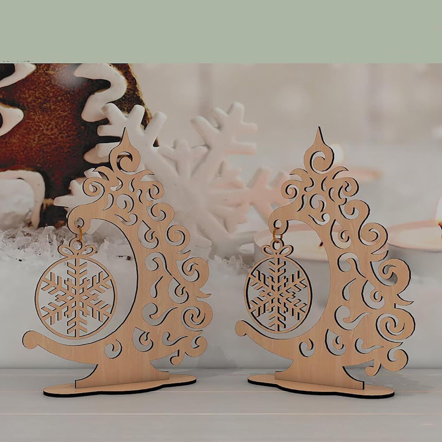 Two wooden decorative items with snowflake designs on a light background