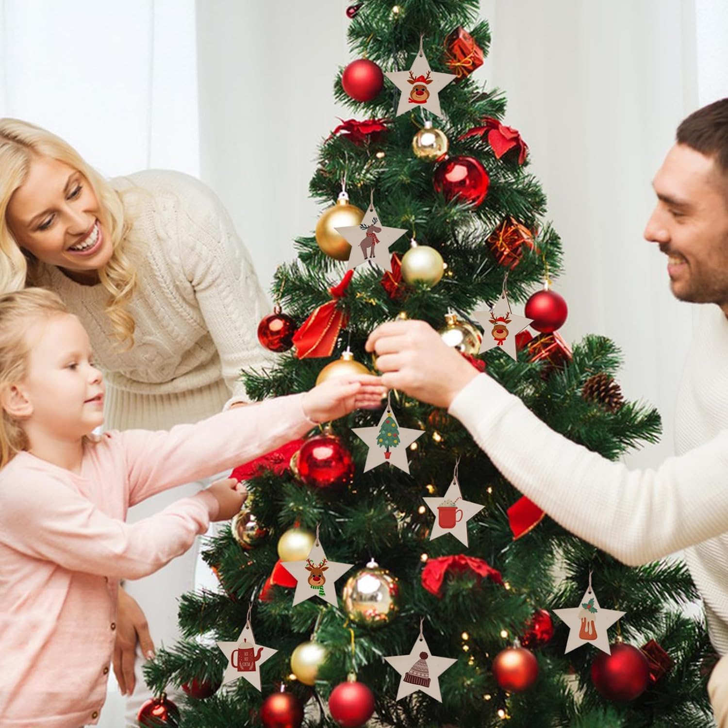 Family decorating a Christmas tree with ornaments.