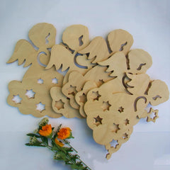 Wooden cutout shapes of angels and flowers on a white background