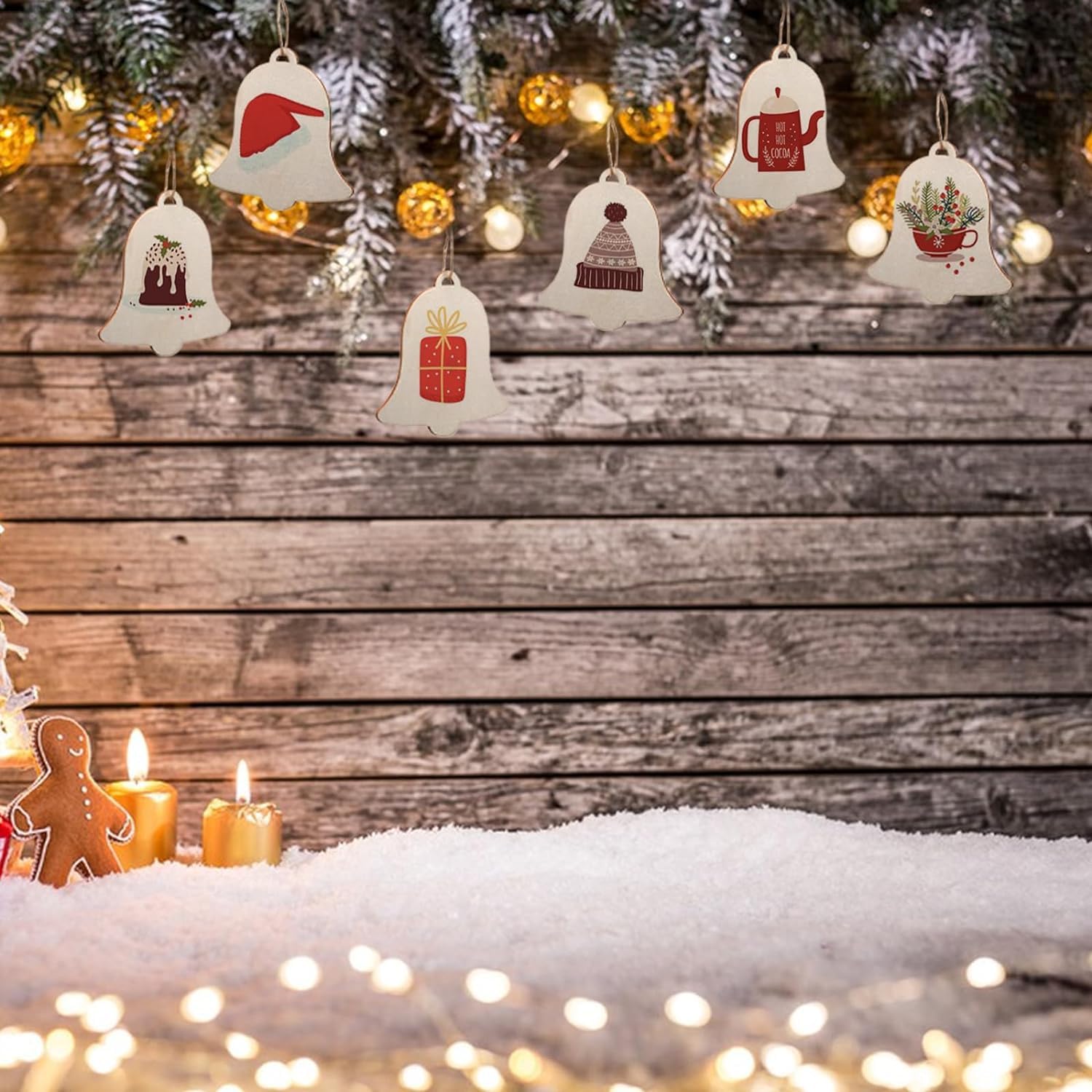 Decorative Christmas ornaments on a wooden background with lights and snow.
