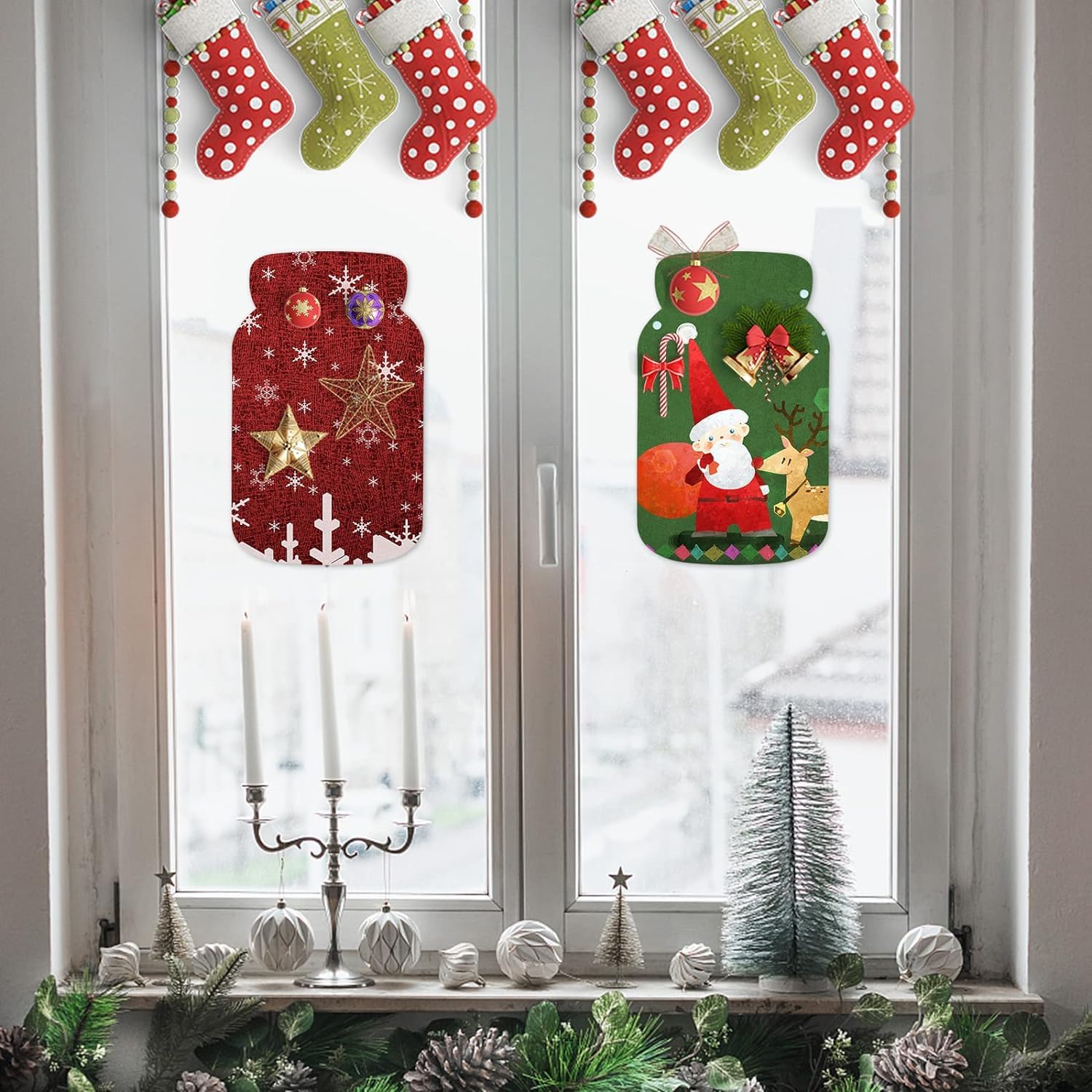 Christmas window decorations with festive jars and stockings.