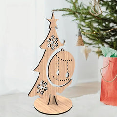 Wooden Christmas tree decoration with snowflakes and a star on a white background.