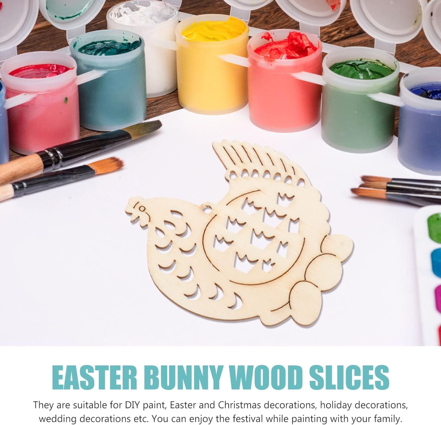 Wooden Easter bunny slices with paint cans and brushes on a table