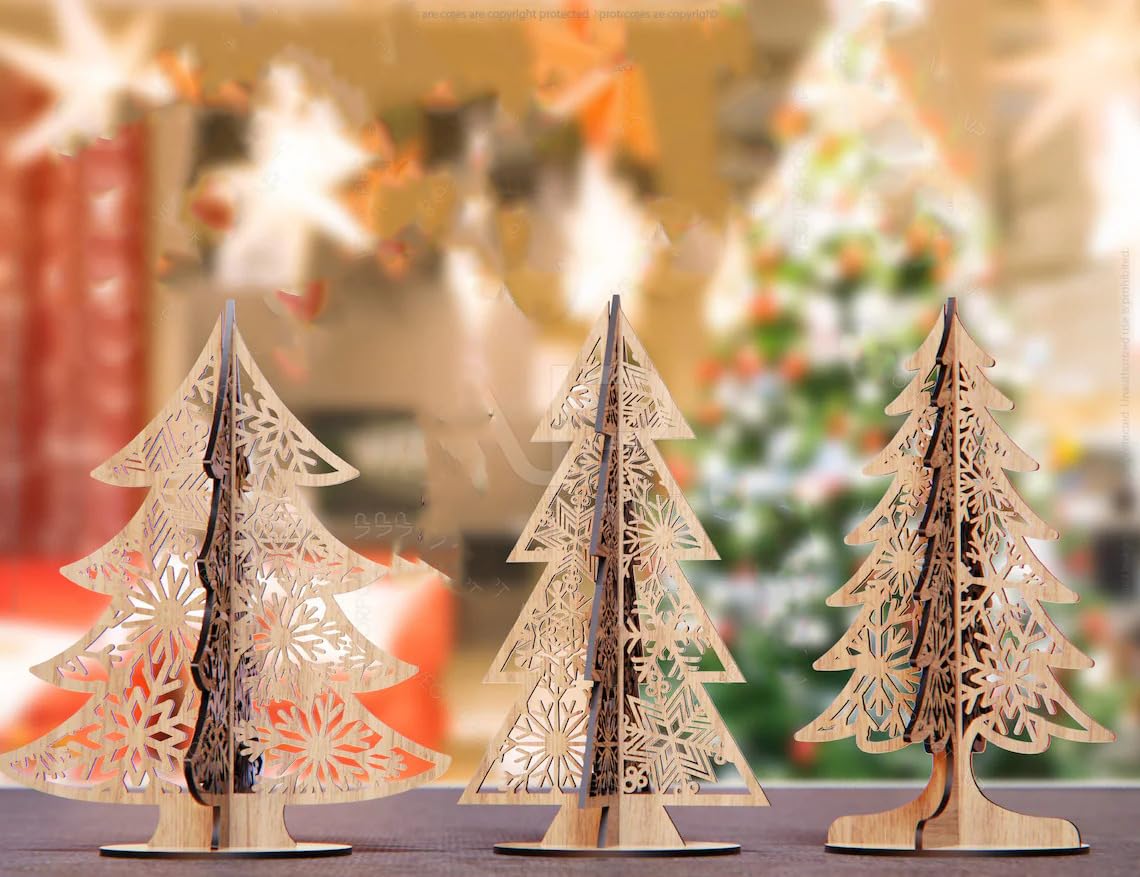 Three wooden Christmas tree decorations on a table with a blurred festive background.
