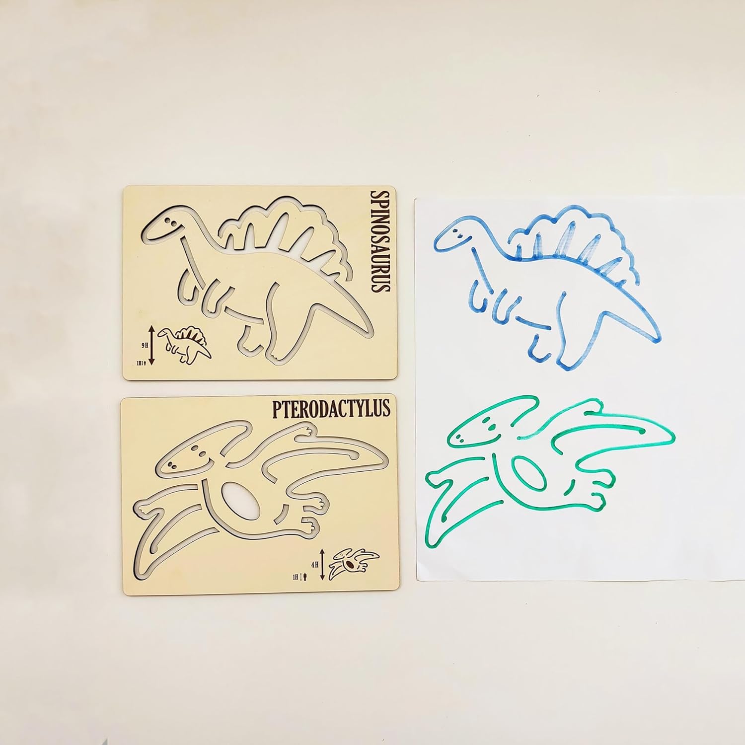 Dinosaur stencils with traced outlines on a beige background