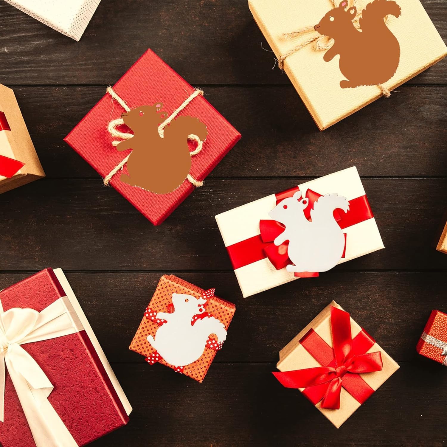 Decorative gift boxes with animal illustrations on a wooden surface