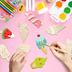 Colorful craft materials including ice cream cones, watermelon slices, and paintbrushes on a pink background.