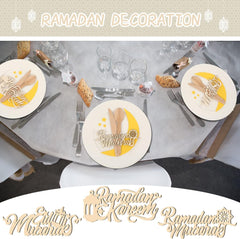 Table setting with 'Ramadan Mubarak' decorations on plates and cutlery.