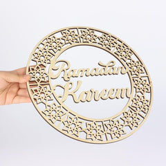 Wooden decorative plate with 'Ramadan Kareem' text on a white background